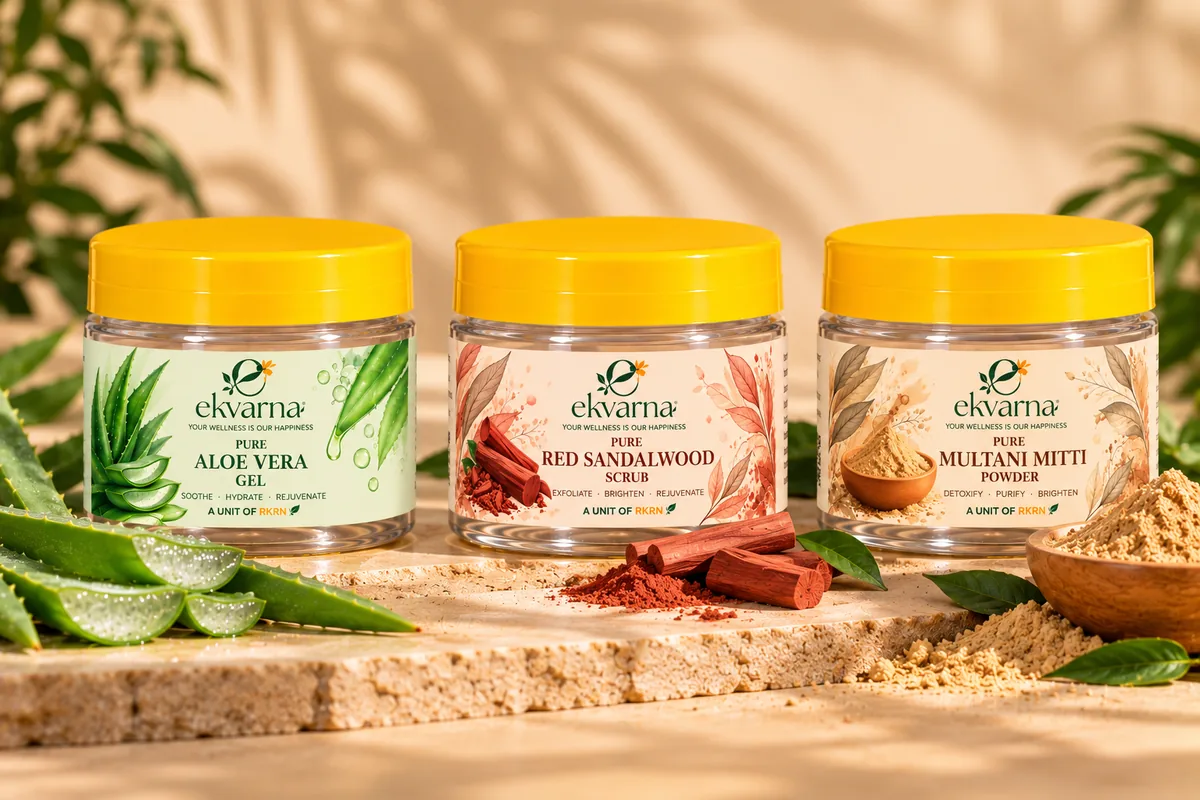 Ekvarna Aloe Vera Gel, Red Sandalwood Scrub and Multani Mitti Powder jars on a stone slab with fresh aloe, sandalwood and clay